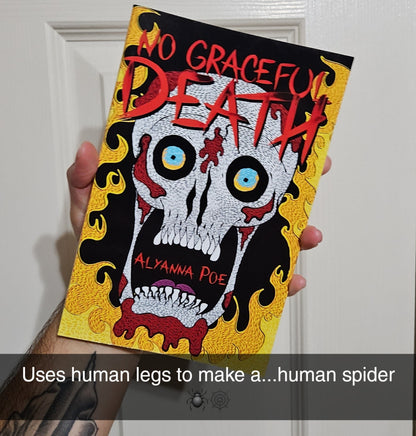 Book titled 'No Graceful Death' held by a person with tattoos, against a white door background.