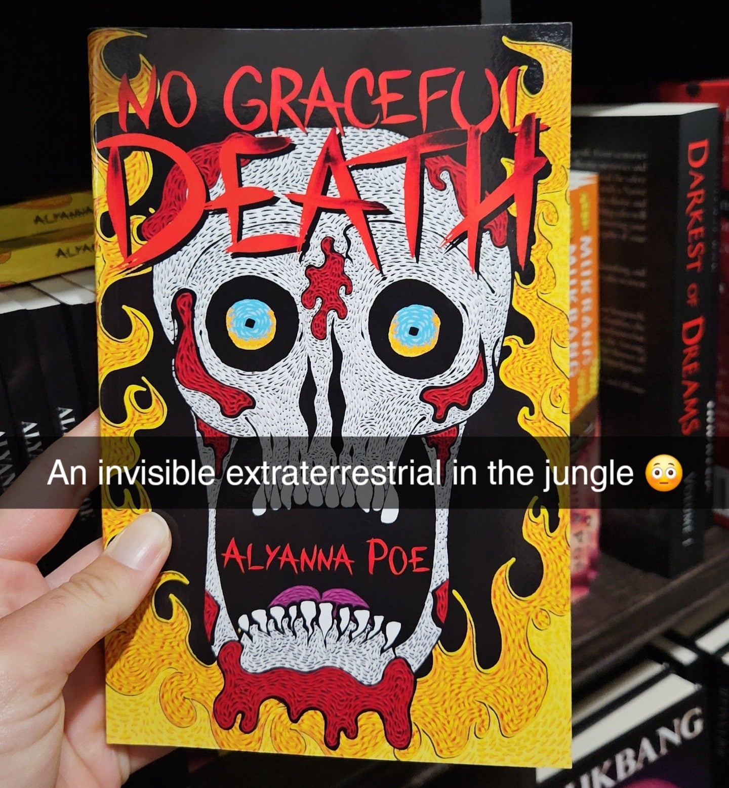 Book titled 'No Graceful Death' held by a hand with a dark background